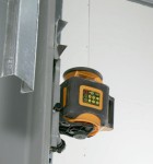 Mult-function mount easily affixes laser level to a wall or track